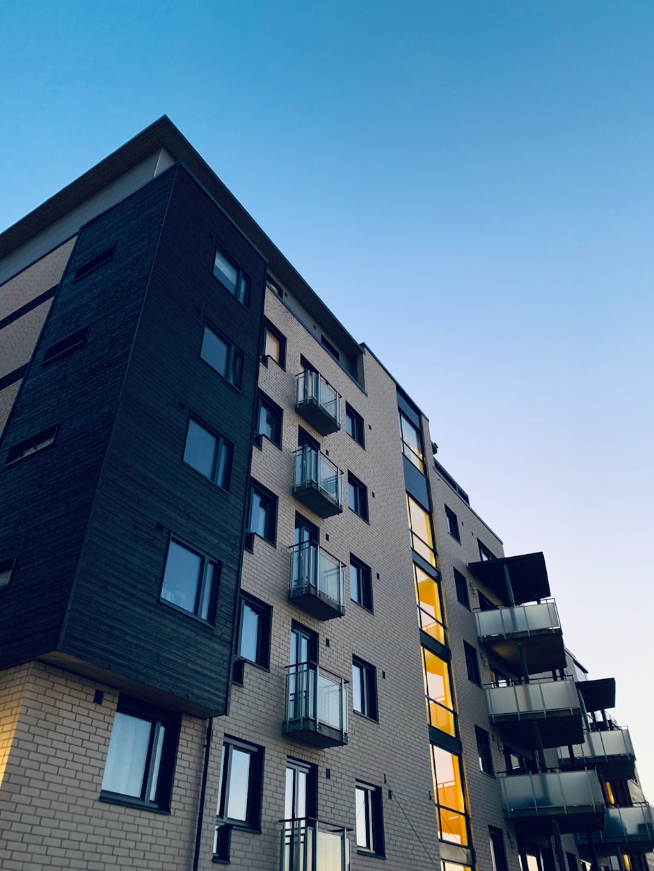 Low-angle photo of a tall residential building.